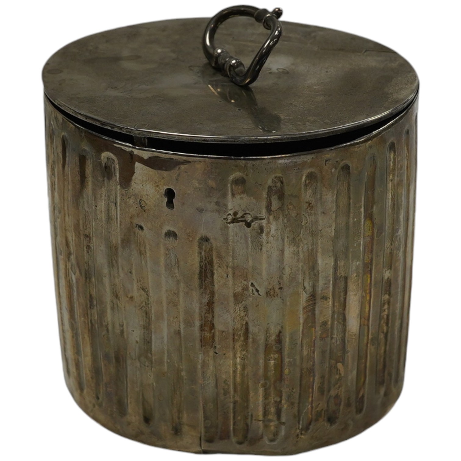 A George III fluted silver lead lined circular tea caddy, by Walter Tweedie, London, 1772, height 10cm excluding handle. Condition - poor